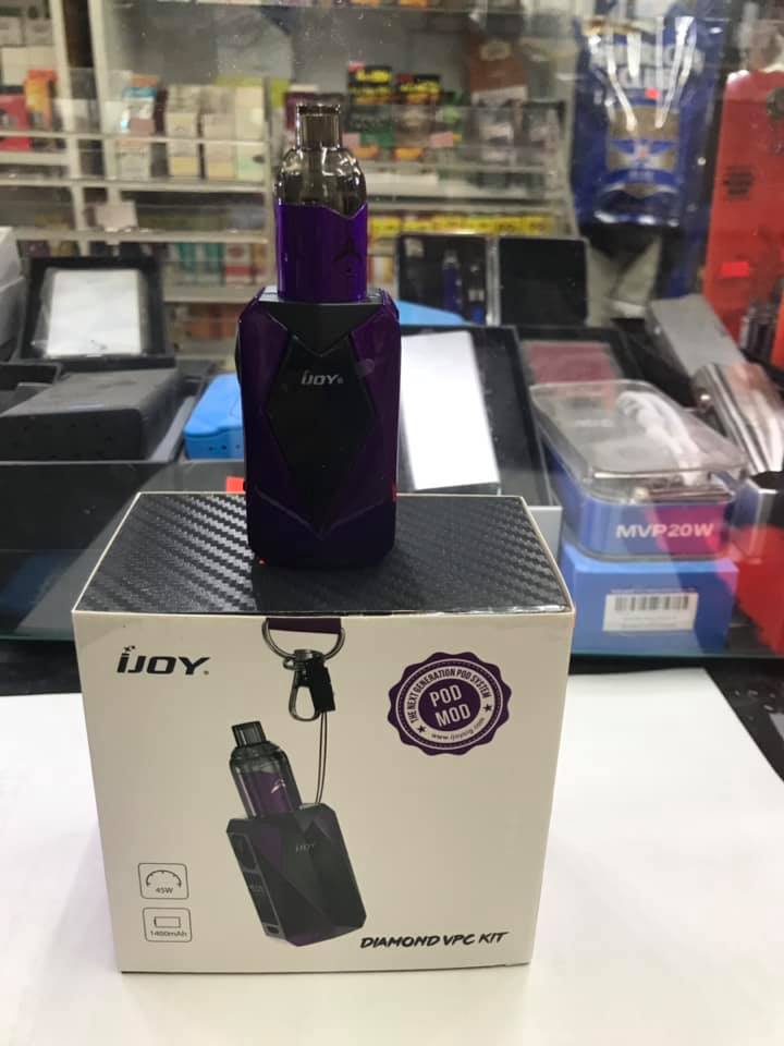 Purple IJOY vape device on box. Diamond VPC Kit. Display in store with other vaping products visible.